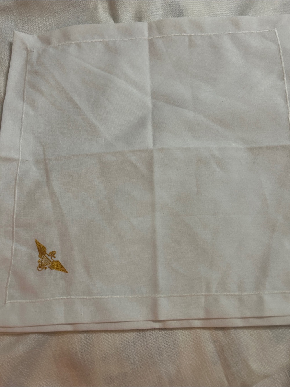White Embroidered Napkins with Gold Winged Emblem set of 4. 16x16